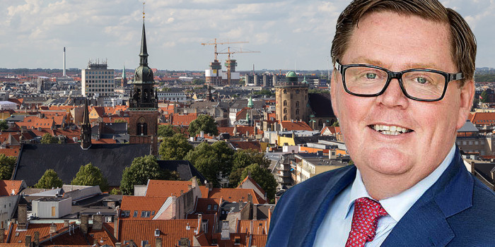Montage of Jesper Damborg, CEO of Capital Investment, and the Copenhagen skyline.